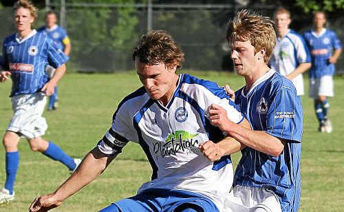Northern Storm captain Nathan Skinner keeps Woolgoolga’s Alex Davey at bay. Northern Storm captain Nathan Skinner keeps Woolgoolga’s Alex Davey at bay.
